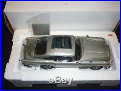 A Danbury mint scale model car of a James Bond's Aston Martin DB5, Goldfinger