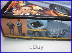 Doyusha Un-made plastic kit of a James Bond's Aston Martin DB5, with figures