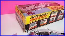 Gilbert James Bond Aston Martin 1965 Tin Toy Battery Operated with Original Box