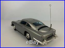 Vintage 1960's GILBERT JAMES BOND 007 Aston Martin DB5 Battery Tin Toy Car Works