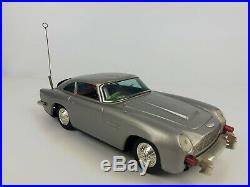 Vintage 1960's GILBERT JAMES BOND 007 Aston Martin DB5 Battery Tin Toy Car Works